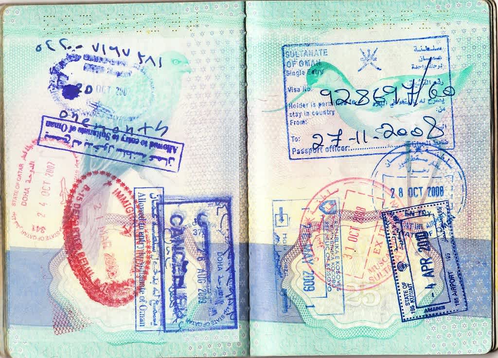 Passport page showing Qatar and neighboring countries' visa and entry stamps from 2007 to 2009